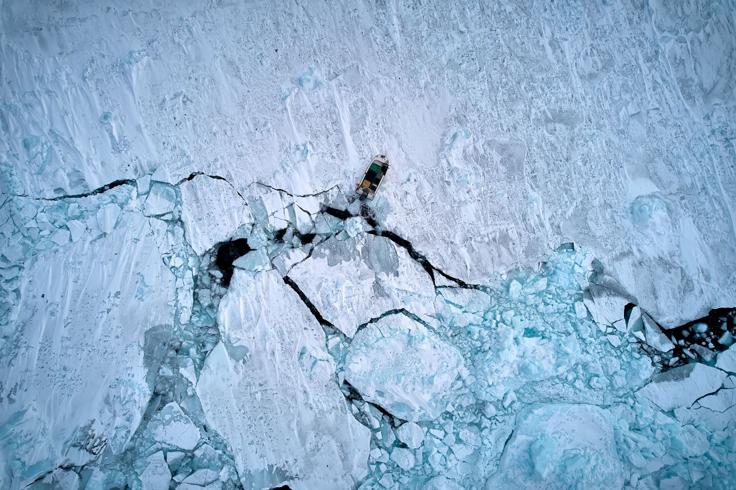 Arial view of ship breaking through ice