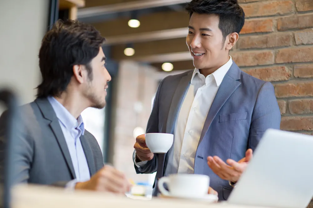 asian professionals discussing brand strategies